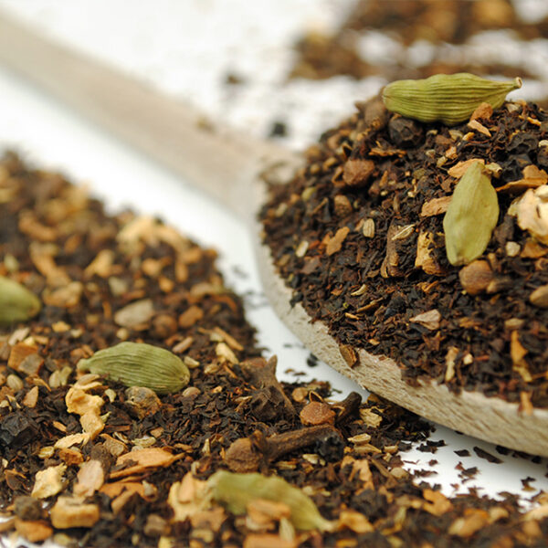 Masala Chai Organic Black Tea by True Tea Company Masala Chai Black Tea on a wooden spoon