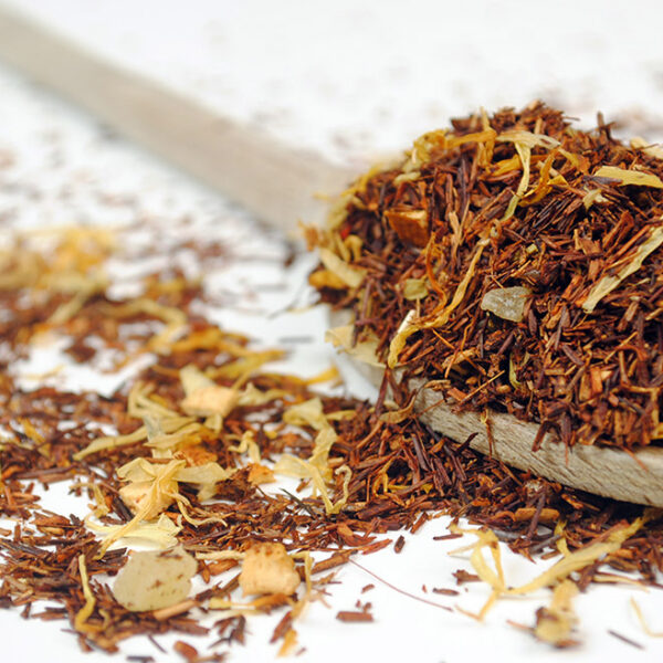 Pineapple Lemon Sorbet Rooibos Tea by True Tea Company pineapple rooibos tea on a wooden spoon