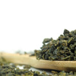 Milky Oolong Fujian China on a wooden spoon