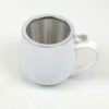 white tea cup with infuser