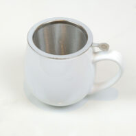 white tea cup with infuser