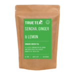 Sencha, Ginger and Lemon Green Tea product packaging. A green label on top of a brown Kraft packet which is eco friendly.