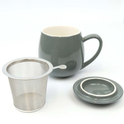 grey tea cup with loose tea infuser