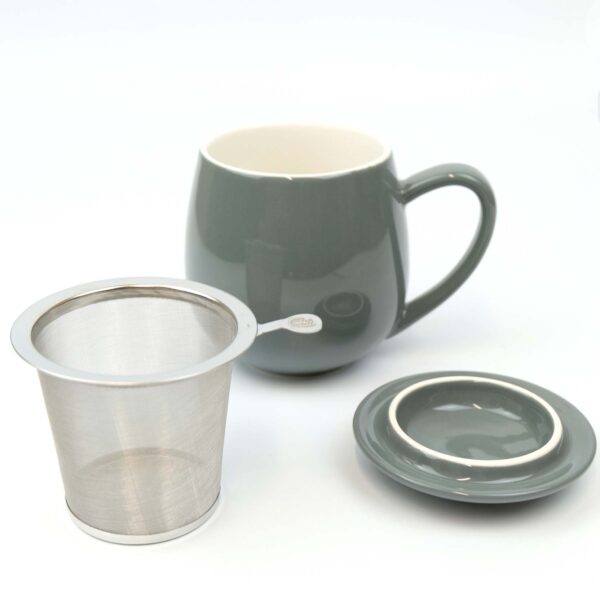grey tea cup with loose tea infuser