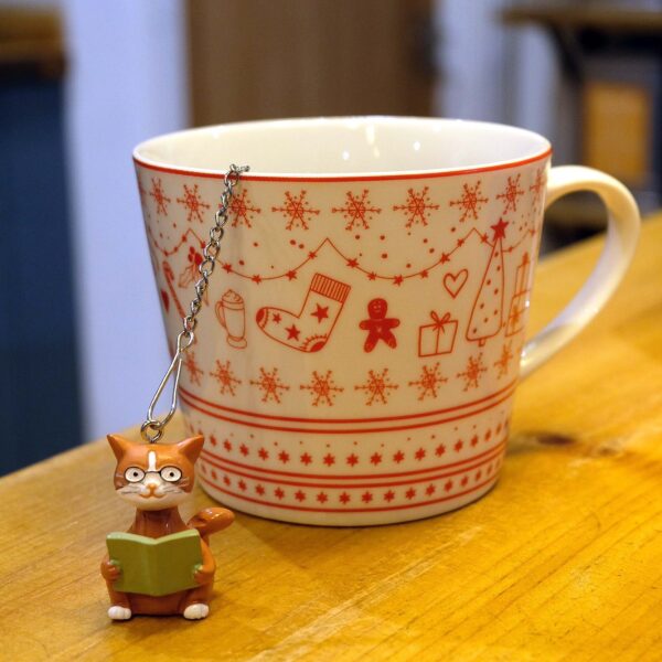cat and book stainless steel tea ball